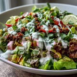 Sliced radishes, diced tomatoes, and fresh cilantro garnish this colorful Healthy Taco Bowl.