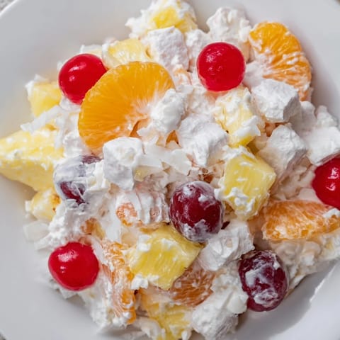 Classic Ambrosia Salad brimming with vibrant mandarin oranges, perfect for a potluck.
