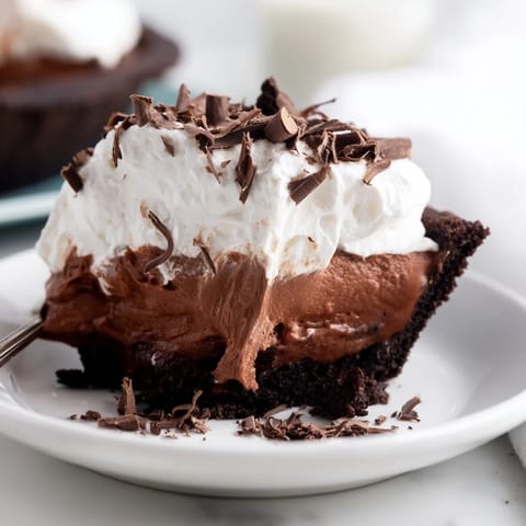 This delicious Mississippi Mud Pie features a fudgy brownie base, perfect for a special occasion dessert.