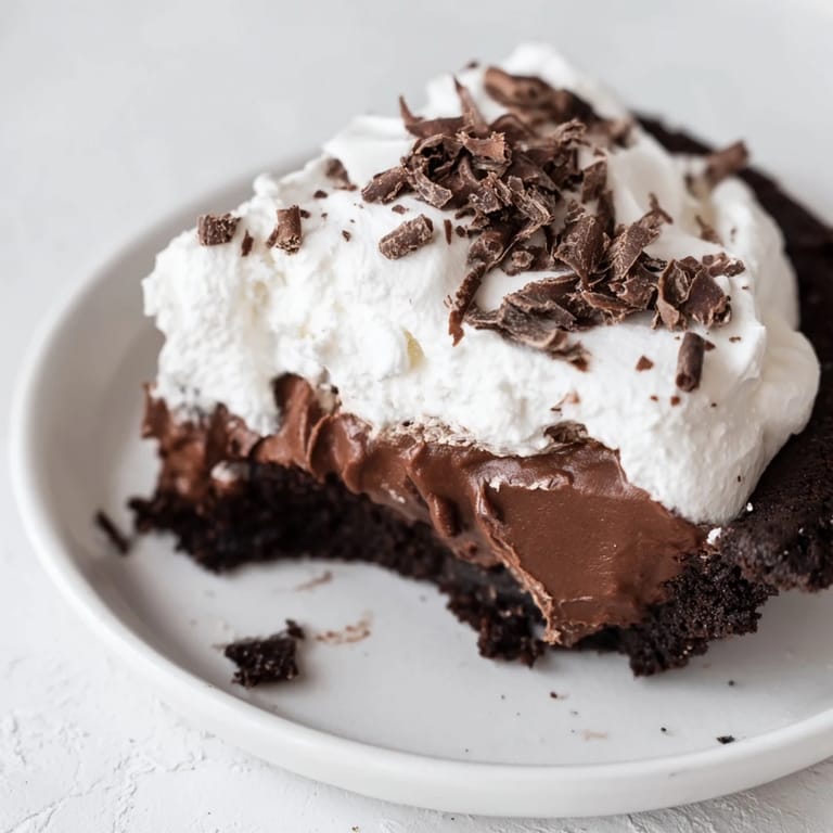 Indulge in this image of Mississippi Mud Pie, a classic American dessert with chocolate shavings.