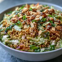 Vibrant Crunchy Ramen Chicken Salad featuring tender chicken, crisp slaw, and toasted nuts.